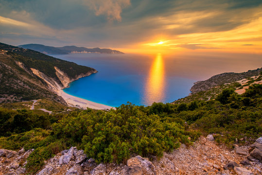 Beautiful summer sunset on Mirtos beach in Greece