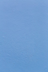 Blue sheet of cardboard paper with rough surface texture background. Textures on the blue wall use for background. Empty interior with blue wall or a blue floor.