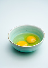 Fresh eggs in a blue porcelain bowl.Healthy,breakfast