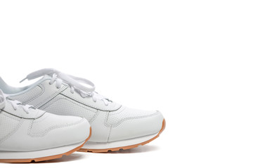 Toes of New White Modern Trainers Placed over Over White Background.