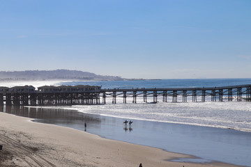 Views of Crystal Pier at Pacific Beach with the beach bungalows above the surf