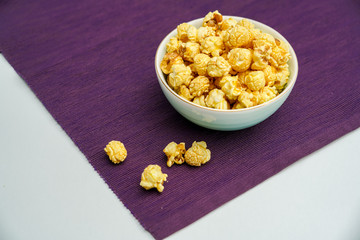 A bowl of popcorn on the purple lining