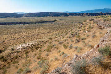 USA, Nevada, Clark County, Mesquite. The morning sun rises over Flat Top Mesa and shines into Toquop Wash.