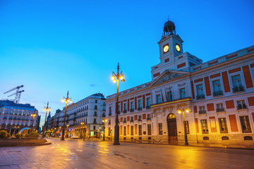 Fototapeta na wymiar Madrid Spain, night city skyline at Puerta del Sol and Clock Tower of Sun Gate
