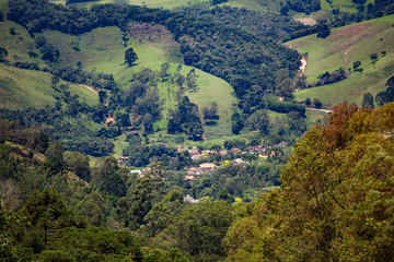 
Small rural settlement wedged in the middle of the mountains horizontal