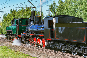 Fototapeta na wymiar Retro steam locomotives at sunny day time.