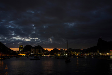 Fototapeta premium Rio de Janeiro skyline at sundown view from Urca wall