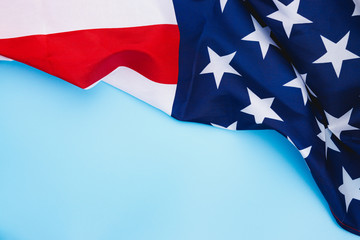 US American flag on blue background. For USA Memorial day,  Memorial day, Presidents day, Veterans day, Labor day, Independence day, or 4th of July celebration. Top view, copy space for text.