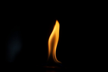 Tongue of fire flame in the dark. Ignition of oxygen in space. Fiery background. Fire of ether in...