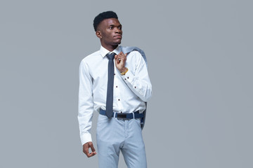 Young black man. Portrait successful smiling cheerful african american businessman executive stylish company leader. Isolated on grey background.