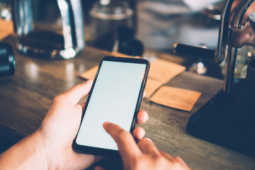 Woman hand use smartphone to do work business, social network, communication with white screen as copyspace.