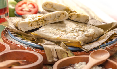 Tamales Oaxaqueños, Mexican dish made with corn dough, chicken or pork and chili, wrapped in a banana leaves.