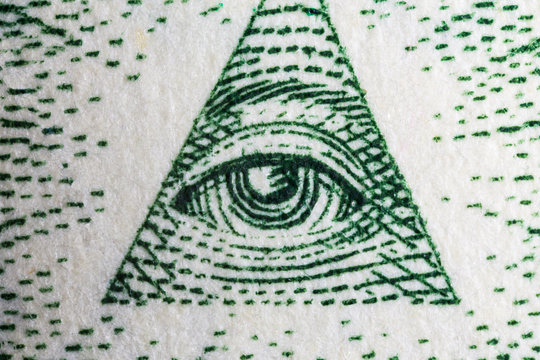 Macro close up photograph of the Eye of Providence on the US one dollar bill.