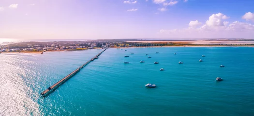 Fototapeten Lila Beachport jetty and moored boats in South Australia at sunset - aerial panorama  © Greg Brave