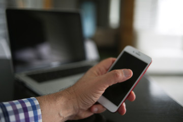 Audio, video and photography business office with equipment such as laptop, mobile phone, headphones and camera with photographic accessories