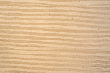 Textured yellow sand on the beach
