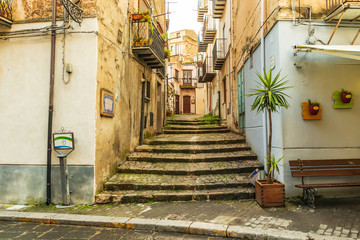 Fototapeta na wymiar Italy, Sicily, Palermo Province, Castelbuono. Stairs on a narrow side street in the town of Castelbuono.
