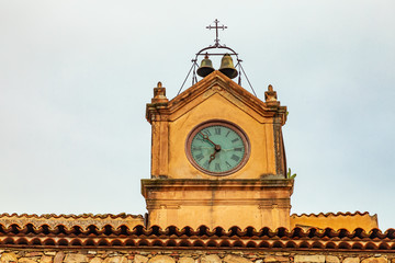 Italy, Sicily, Palermo Province, Castelbuono. Clock tower on the piazza in the town of Castelbuono.