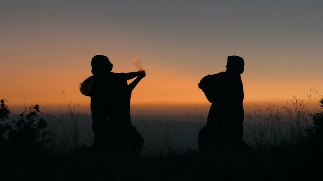 Epic duel with light swords between two Warrior