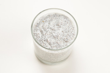 Chia pudding  in glass on a white background. Space for text or design.
