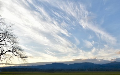 Skies, clouds and mountains