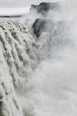 Dettifoss waterfall in Iceland. The most powerful waterfall in Europe. Breathtaking and dramatic view. Vertical photo.