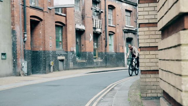 Businessman riding bicycle in London