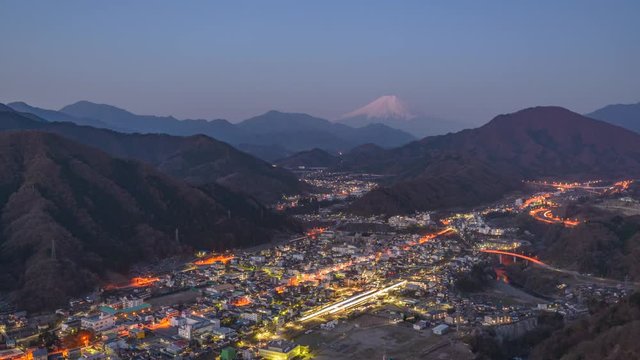 Otsuki, Yamanashi, Japan town skyline from the mountains with Mt. Fuji in the Distance