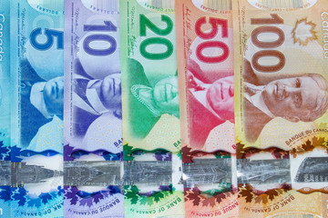Calgary Alberta, Canada. Jan 27 2020. Canadian bills line up on a vertical view. Canadian dollar...