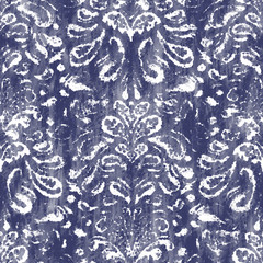Damask indigo dyed effect distressed worn bleached graphical motif. Noisy brushed faded mottled, intricate grungy stained navy design. Seamless repeat vector eps 10 pattern swatch.