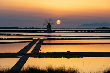 Italy, Sicily, Trapani Province, Marsala. Wind mills at the salt evaporation ponds in the Stagnone...