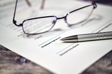 Pen for signature contract. Business concept with glasses