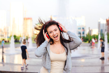 Fototapeta premium Girl listening to music streaming with headphones.