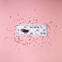 Lotto ticket with wood barrel 14 number on pink hearts background. Valentines day 14 february minimal concept. Square format