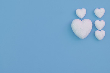 Love hearts on a blue background for valentines day concept