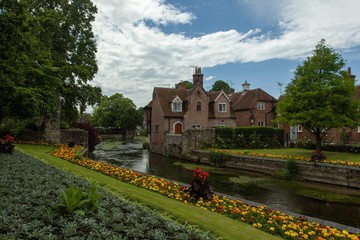 Road surrounded by buildings and gardens after the rain in Canterbury in the UK