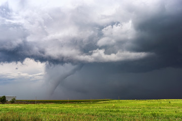 Tornado with dark storm clouds