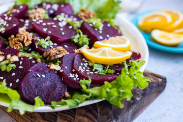 Fototapeta na wymiar Cooked beetroot and walnut salad. Vegan healthy food