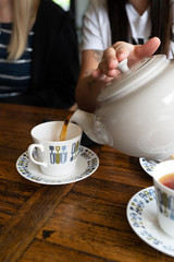 Pot of tea being poured