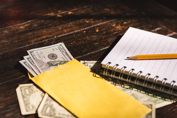 Bills on a wooden table, counting money - Budget