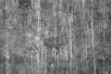 Texture of a concrete wall with cracks and scratches which can be used as a background