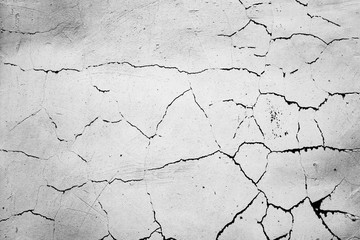Texture of a concrete wall with cracks and scratches which can be used as a background