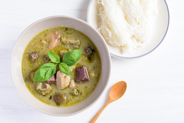 Thai green curry chicken in a bowl eating with rice noodles, Thai food