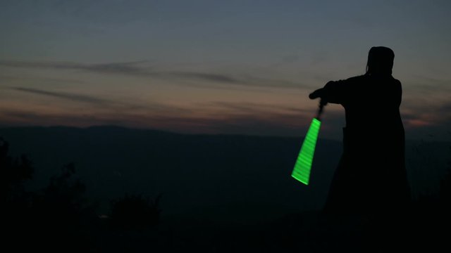 Two sci-fi knights with light swords on battlefield