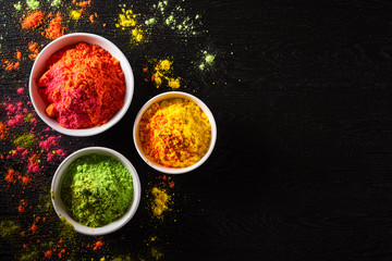 Holi festival celebration. Traditional Indian Holi colours powder decoration with paints. Top view...