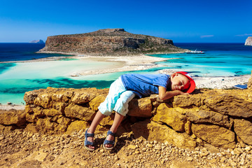 Balos lagoon on Crete island, Greece. Tourists relax and bath in crystal clear water of Balos beach. The most unique natural attraction in Crete.