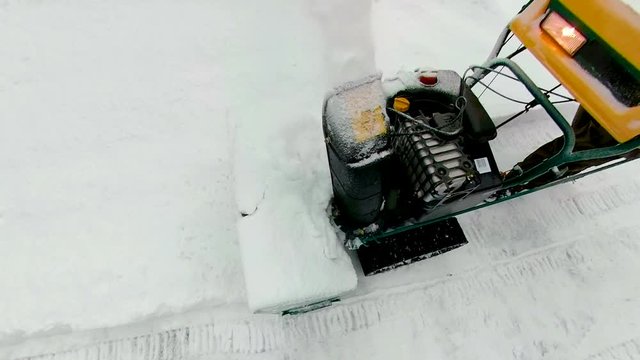 Closer look of the snow plower machine on the ground in Estonia