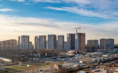 Fototapeta na wymiar panorama of modern residential quarters in new places in Moscow on an autumn day