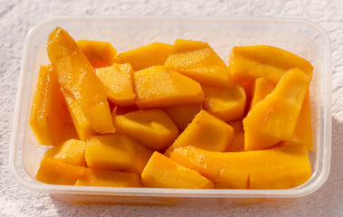 slices of ripe mango as background