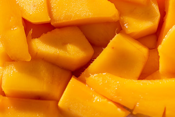 slices of ripe mango as background